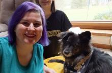 photo of Dr Robison and family displaying school spirit (Manchester University Spartans) at home 